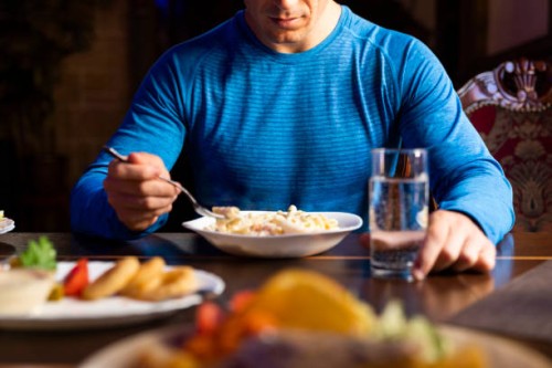 close-up of athlete eating pasta dish - food stock pictures, royalty-free photos & images