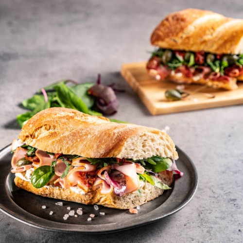 close-up of burger on table - junk food stock pictures, royalty-free photos & images