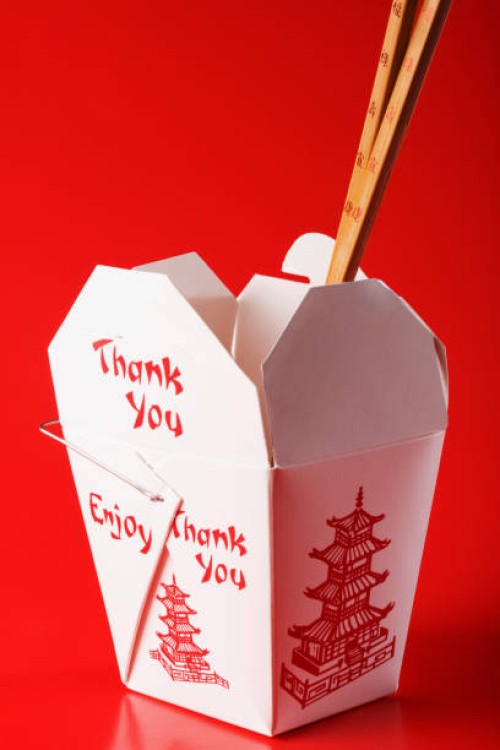 close-up of chopsticks in a chinese takeout box - junk food stock pictures, royalty-free photos & images