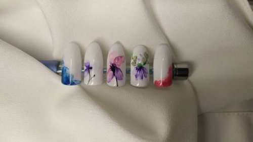 close-up of colorful artificial nails with nail art on them - nails art stock pictures, royalty-free photos & images