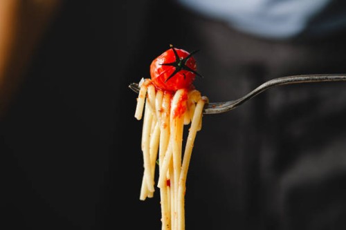 close-up of eating freshly made pasta with fork. - food stock pictures, royalty-free photos & images