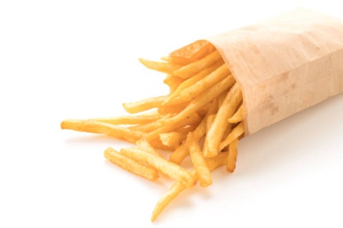 close-up of french fries against white background - junk food stock pictures, royalty-free photos & images