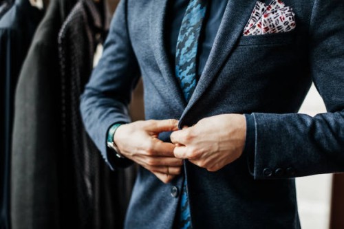 close-up of man buttoning up suit - fashion stock pictures, royalty-free photos & images