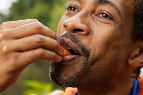close-up of man eating - food fotografías e imágenes de stock