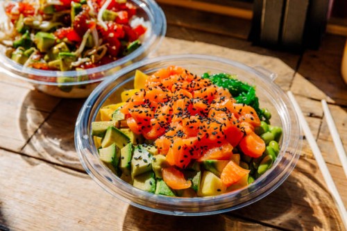 close-up of poke bowl with salmon and various toppings - junk food stock pictures, royalty-free photos & images