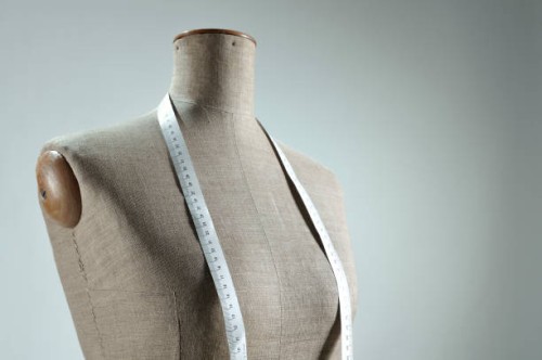 close-up of retro female tailor's mannequin torso with measuring tape - fashion stock pictures, royalty-free photos & images