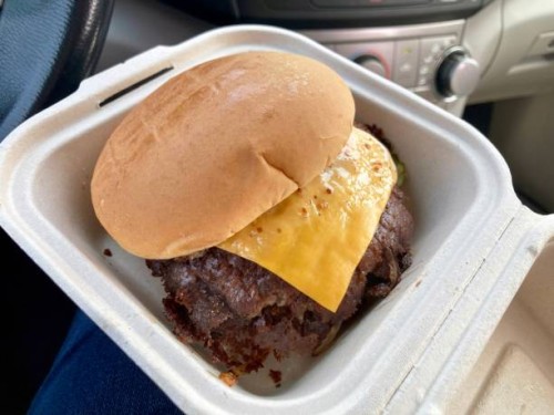 close-up of smashburger in to-go box inside car - junk food stock pictures, royalty-free photos & images