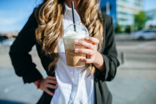 close-up of take away coffee in business woman hand - junk food stock pictures, royalty-free photos & images