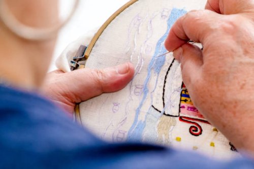 close-up of the hands of an elderly woman embroidering on a fabric. tr - nails art stock pictures, royalty-free photos & images