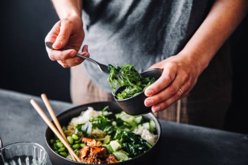close-up of woman eating omega 3 rich salad - food stock pictures, royalty-free photos & images