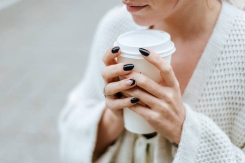 close-up of woman's hands with take away drink - junk food stock pictures, royalty-free photos & images