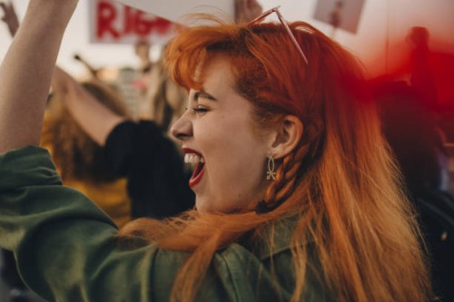close-up of young woman shouting while protesting for rights - fashion stock pictures, royalty-free photos & images