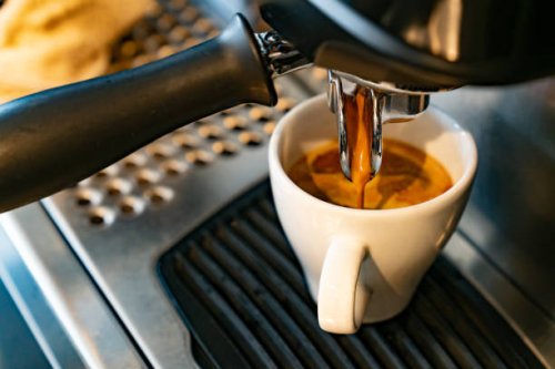 close-up on a coffee maker making a espresso - coffee stock pictures, royalty-free photos & images