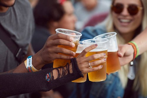 close-up uf hands toasting in beer, at festival - concert stock pictures, royalty-free photos & images