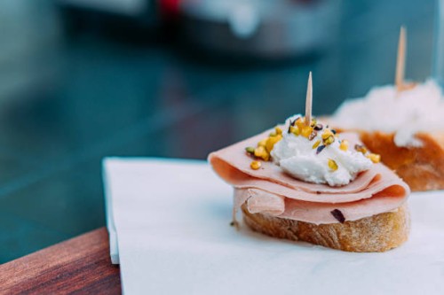 close-up view of a venetian cicchetti with mortadella, baccalà mantecato, and pistachio in venice, italy - food stock pictures, royalty-free photos & images