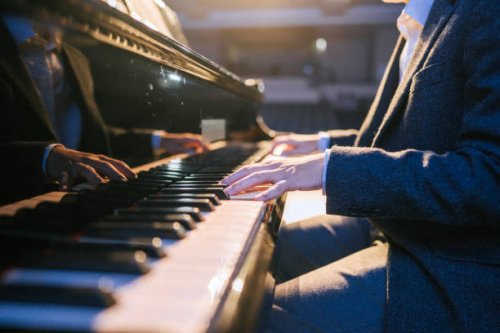 close up asian talented chinese pianist finger playing performing on stage - concert stock pictures, royalty-free photos & images