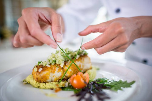 close up of a chef decorating a plate - food stock pictures, royalty-free photos & images