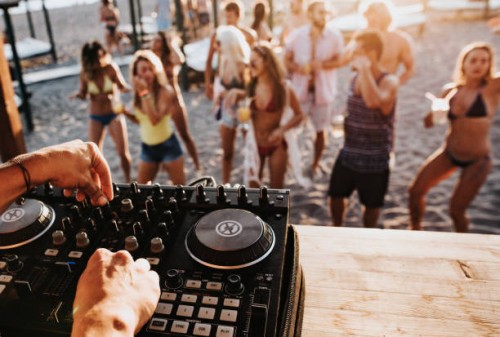 close up of a dj playing music on the beach party. - concert stock pictures, royalty-free photos & images