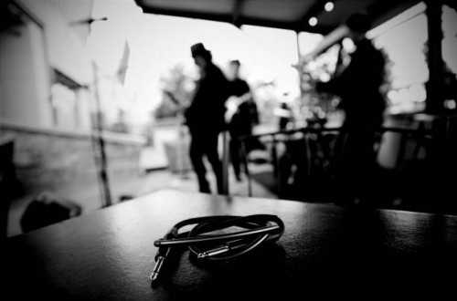 close up of a phono jack with rock and roll band behind - concert stock pictures, royalty-free photos & images