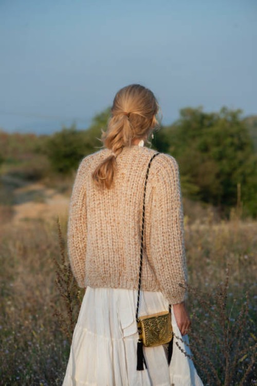 close up of a woman wearing handmade wool sweater - fashion stock pictures, royalty-free photos & images