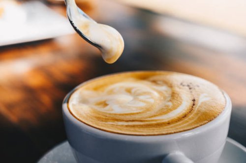 close up of creamy surface of hot latte coffee. - coffee stockfoto's en -beelden