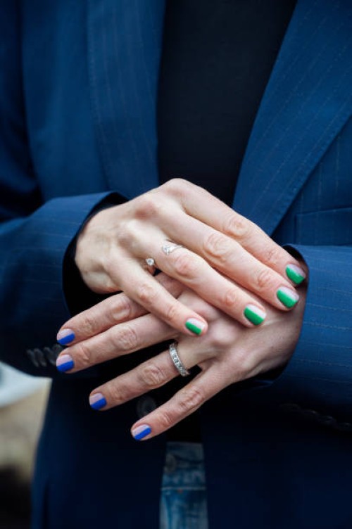 Close up of Emilia de Poret manicure, blue and green nails outside Teurn studios presentation in Stockholm fashion week Autumn/Winter 2022 on...