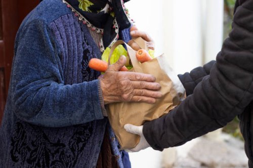 close up of old woman receiving take away food delivery - food stock pictures, royalty-free photos & images