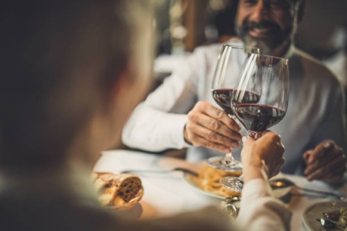 close up of toasting with wine in a restaurant! - food stock pictures, royalty-free photos & images