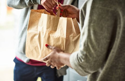 close up of woman receiving take away food delivery - junk food stock pictures, royalty-free photos & images