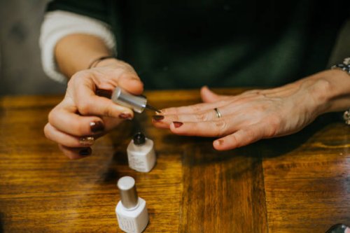 close up of woman with long, slender fingers, paints her nails at home - nails art stock pictures, royalty-free photos & images