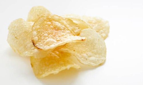 close up on potato chips - junk food stock pictures, royalty-free photos & images