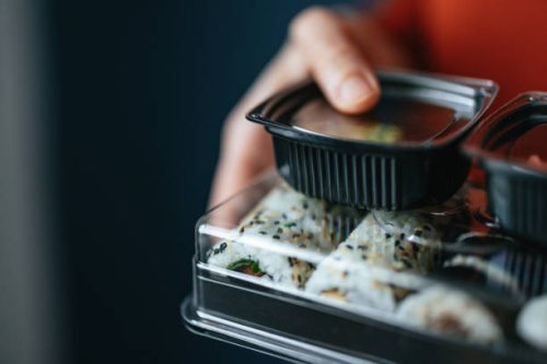 close up photo of woman hands holding takeaway food boxes - junk food stock pictures, royalty-free photos & images