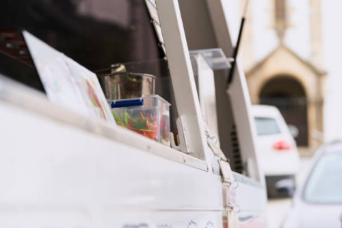 close up view of empty food truck door ice cream at summer in the street - junk food stock pictures, royalty-free photos & images