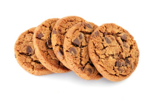 closeup of chocolate chip cookies isolated on white - junk food stock pictures, royalty-free photos & images