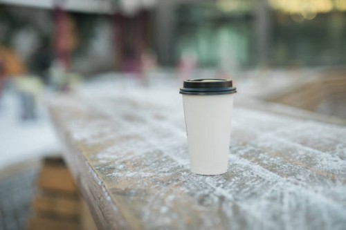 coffee take away stands in winter against of a snowy city background copy space - junk food stock pictures, royalty-free photos & images