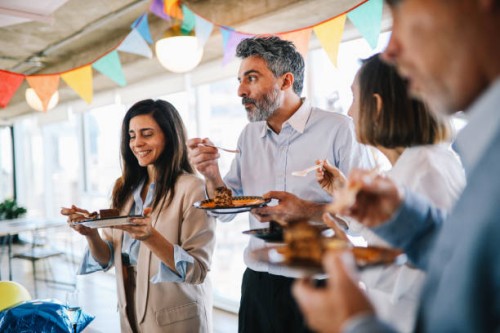colleagues eating cake at the office birthday party - food stock pictures, royalty-free photos & images