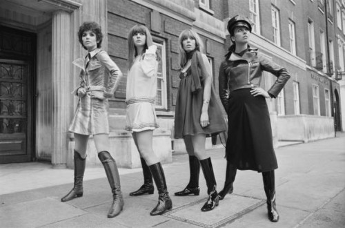 Collection of winter fashions by Ossie Clark and Alice Pollock, on display in a London street. From left to right, Linda Keith wears 'Oz', a...