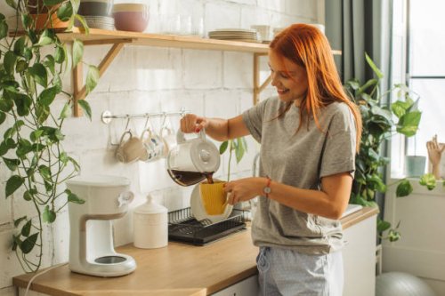 college student at dorm room - coffee stockfoto's en -beelden