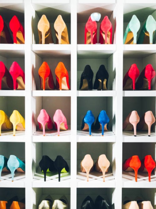 colored high heels on white shelf - fashion stock pictures, royalty-free photos & images