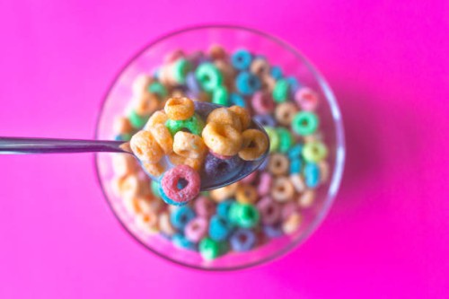 colorful breakfast cereal fills spoon - junk food stock pictures, royalty-free photos & images