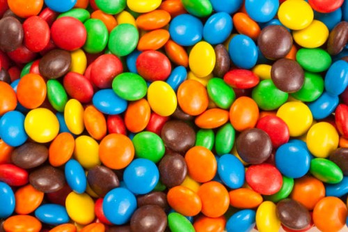 colorful chocolate candy - junk food stock-fotos und bilder