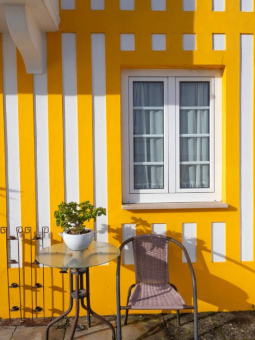 colorful house in costa nova, aveiro, portugal - garden decoration stock pictures, royalty-free photos & images