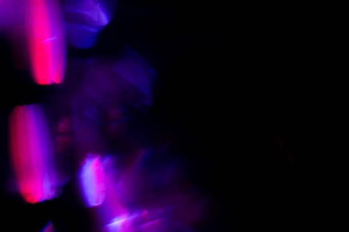 colorful purple pink surreal night city light bokeh on black background - concert stock pictures, royalty-free photos & images