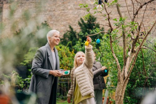 colourful easter eggs in the garden - garden decoration stock pictures, royalty-free photos & images