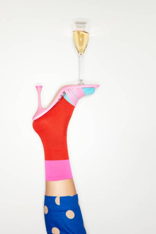 colourful high heels balancing glass of champagne - fashion stock pictures, royalty-free photos & images