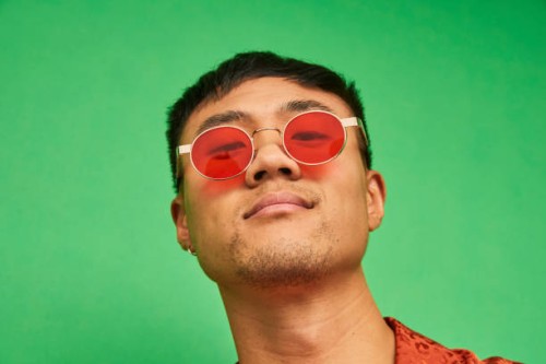 colourful studio portrait of a young man - fashion stock pictures, royalty-free photos & images
