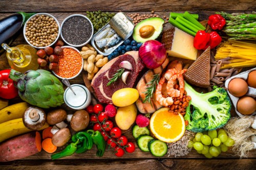 composition of healthy food aranged in a row on wooden table - food stock pictures, royalty-free photos & images