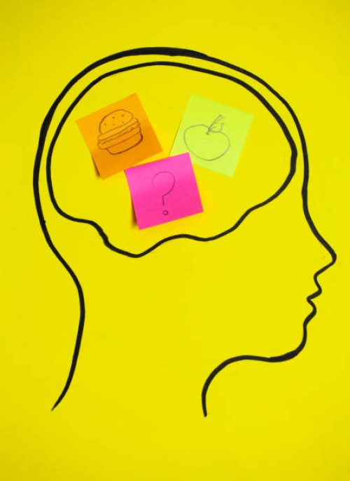 concept art of thoughts inside someones head, trying to decide of what is good. - junk food stock pictures, royalty-free photos & images