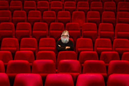 concept loneliness :one man sits in empty cinema or theatre. - concert stock pictures, royalty-free photos & images