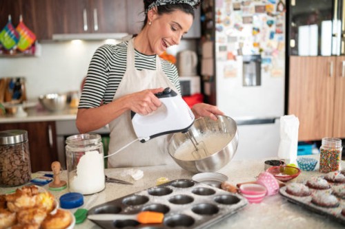 confectioner woman making delicious cream for cupcakes - food stock pictures, royalty-free photos & images